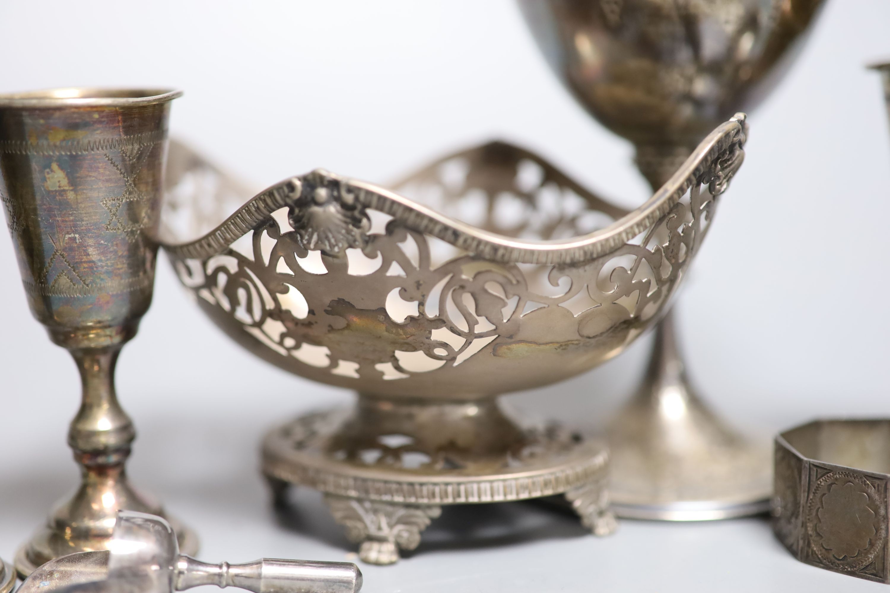 Five George V silver kiddush cups, a late Victorian silver goblet, a silver bonbon dish, silver salt, silver napkin ring and a plated sugar shovel